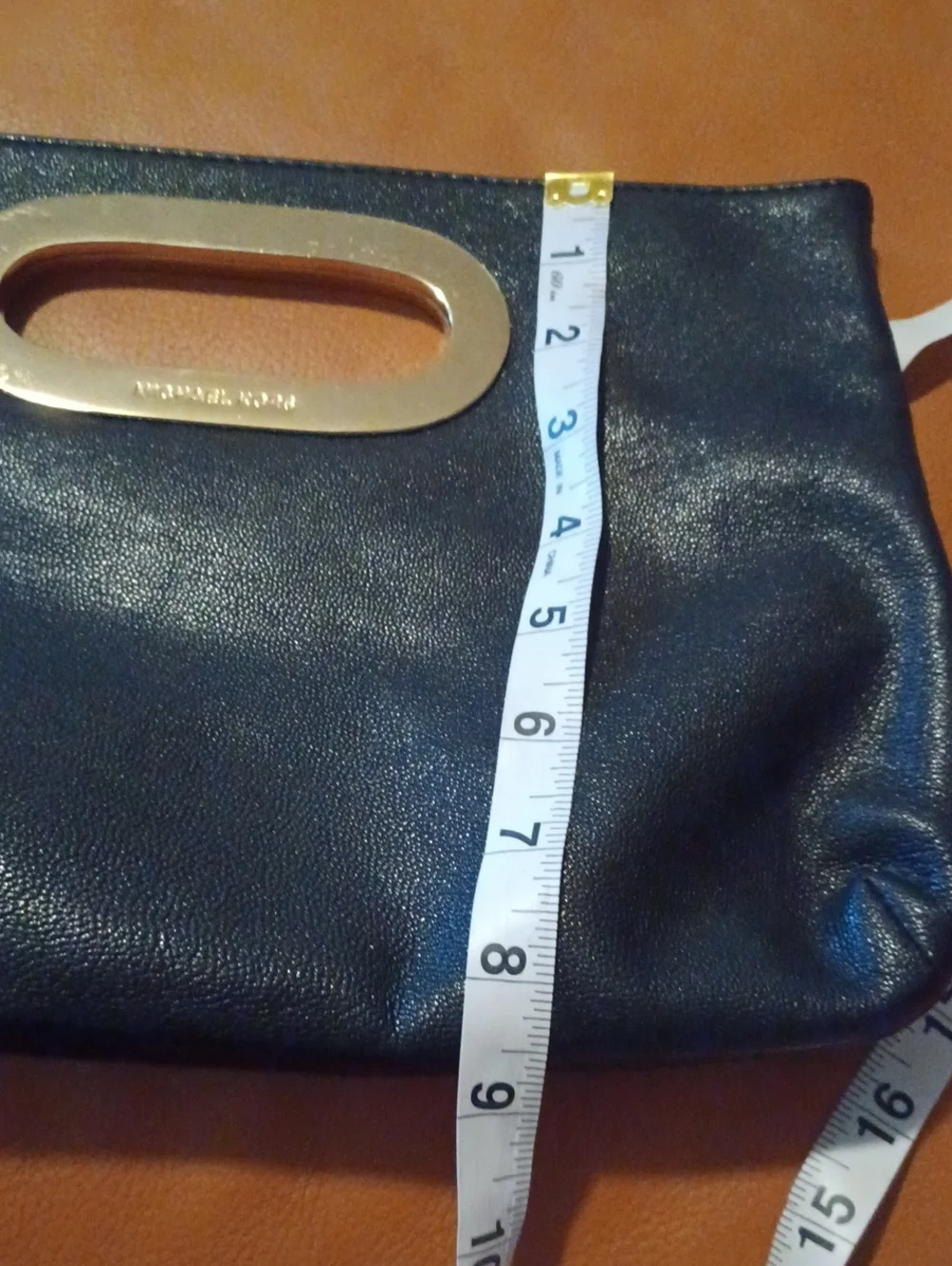 > Michael Kors Black Leather Women's Clutch with Gold Hardware